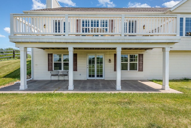 5284 Harvey Rd, Caledonia, IL 61011 - rear view of house with a lawn, a patio, and a deck