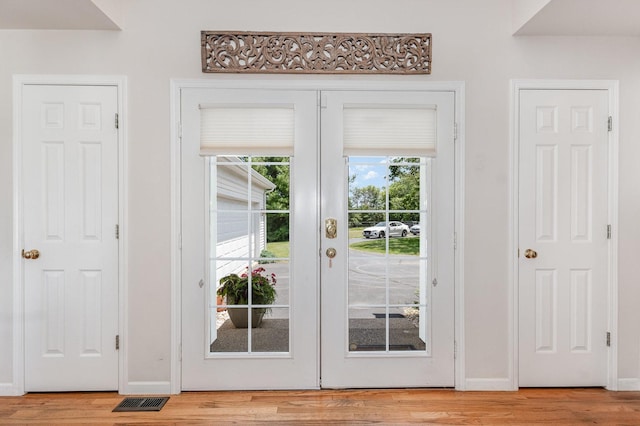 5284 Harvey Rd, Caledonia, IL 61011 - doorway to outside with french doors and light wood-style flooring