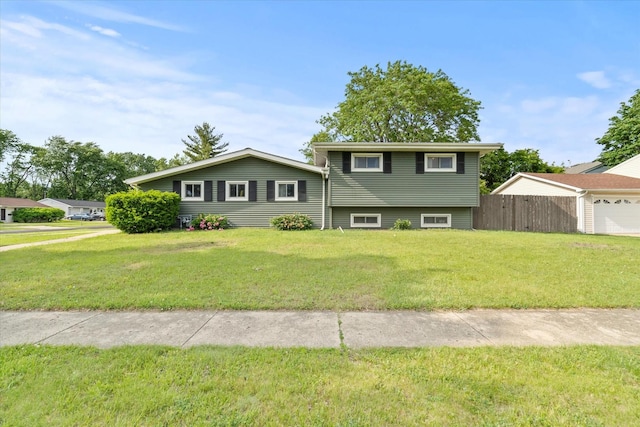 427 Cedarcrest Dr, Streamwood, IL 60107 - split level home featuring a garage