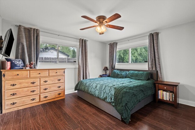 427 Cedarcrest Dr, Streamwood, IL 60107 - bedroom featuring dark wood-type flooring, multiple windows, baseboards, and a ceiling fan