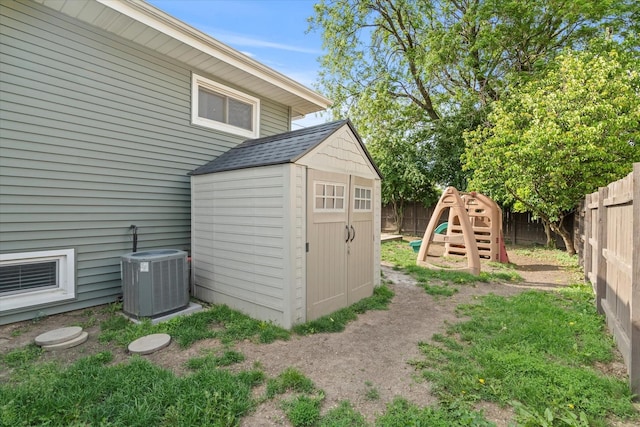 427 Cedarcrest Dr, Streamwood, IL 60107 - view of shed featuring cooling unit and a fenced backyard