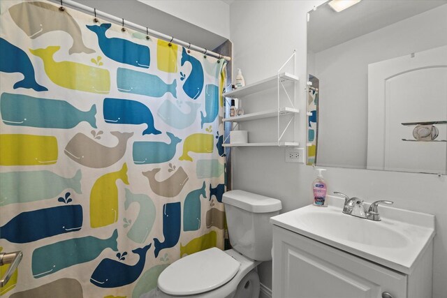 427 Cedarcrest Dr, Streamwood, IL 60107 - bathroom with vanity, toilet, and curtained shower