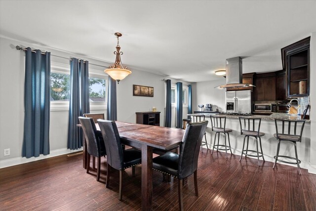 427 Cedarcrest Dr, Streamwood, IL 60107 - dining space featuring dark wood finished floors and baseboards