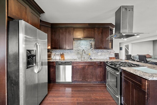 427 Cedarcrest Dr, Streamwood, IL 60107 - kitchen featuring stainless steel appliances, range hood, a sink, dark wood finished floors, and a peninsula