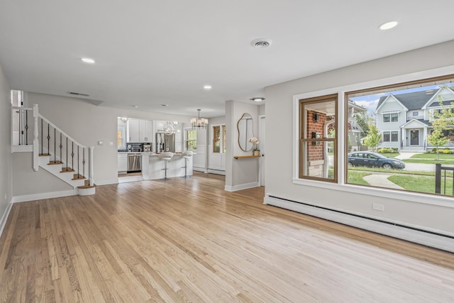 1308 Frances Pkwy, Park Ridge, IL 60068 - unfurnished living room featuring a chandelier, a baseboard heating unit, light wood-style flooring, stairway, and recessed lighting