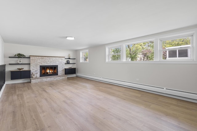 1308 Frances Pkwy, Park Ridge, IL 60068 - unfurnished living room with wood finished floors, a fireplace, and baseboard heating