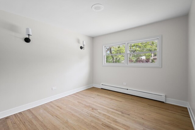 1308 Frances Pkwy, Park Ridge, IL 60068 - unfurnished room featuring baseboard heating and wood finished floors