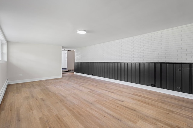 1308 Frances Pkwy, Park Ridge, IL 60068 - spare room featuring brick wall and light wood finished floors