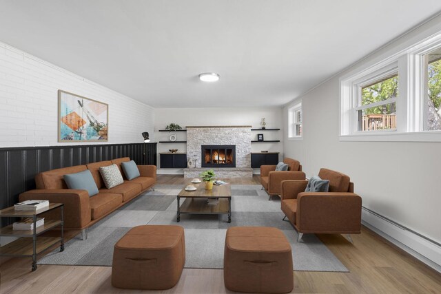 1308 Frances Pkwy, Park Ridge, IL 60068 - living room featuring a baseboard radiator, wood finished floors, a fireplace, brick wall, and an accent wall