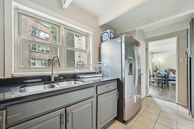 2142 W Rosemont Ave Unit 1A, Chicago, IL 60659 - kitchen with stainless steel refrigerator with ice dispenser, gray cabinets, beam ceiling, dark countertops, and light tile patterned floors