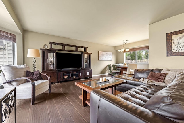 1861 Grosse Pointe Cir, Hanover Park, IL 60133 - living room featuring a chandelier and dark wood-style floors