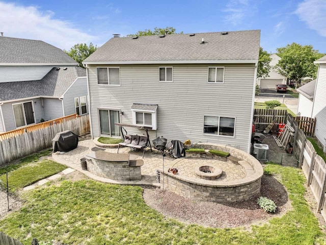 1861 Grosse Pointe Cir, Hanover Park, IL 60133 - back of property with a fire pit, a patio, and a fenced backyard