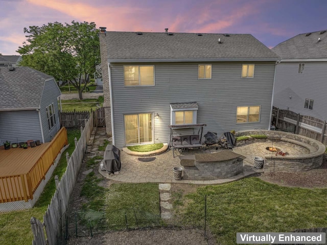 1861 Grosse Pointe Cir, Hanover Park, IL 60133 - rear view of house with an outdoor fire pit, a patio area, a chimney, roof with shingles, and a fenced backyard