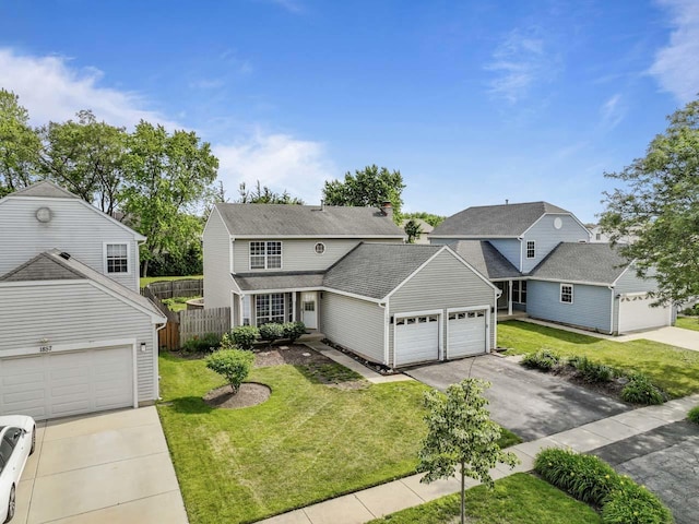 1861 Grosse Pointe Cir, Hanover Park, IL 60133 - traditional-style house featuring asphalt driveway and a garage