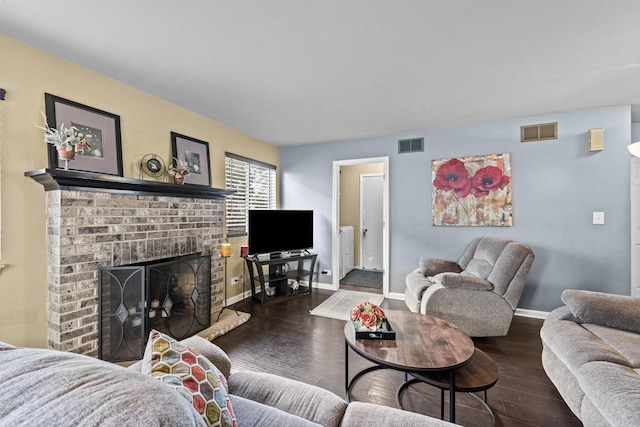 1861 Grosse Pointe Cir, Hanover Park, IL 60133 - living area with radiator, a brick fireplace, and wood finished floors