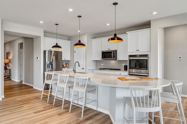 2810 Spring Cir S, Lindenhurst, IL 60046 - kitchen featuring stainless steel appliances, a sink, decorative backsplash, light wood-style flooring, and recessed lighting