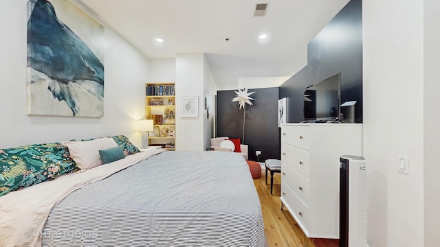 212 W Washington St Unit 1108, Chicago, IL 60606 - bedroom featuring wood finished floors and recessed lighting