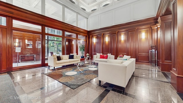 212 W Washington St Unit 1108, Chicago, IL 60606 - living room featuring a decorative wall, a towering ceiling, granite floors, and coffered ceiling