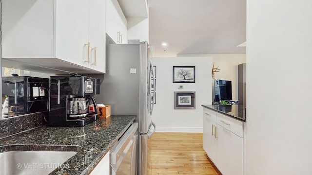 212 W Washington St Unit 1108, Chicago, IL 60606 - kitchen with dishwasher, white cabinets, light wood-type flooring, dark stone countertops, and recessed lighting