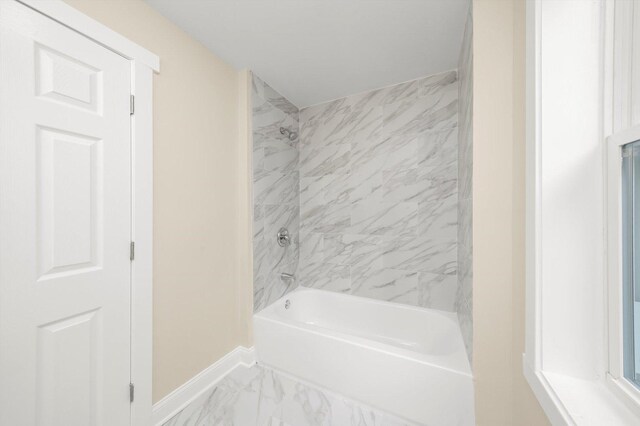 7421 S Eggleston Ave, Chicago, IL 60621 - bathroom featuring baseboards, shower / washtub combination, and marble look tile flooring