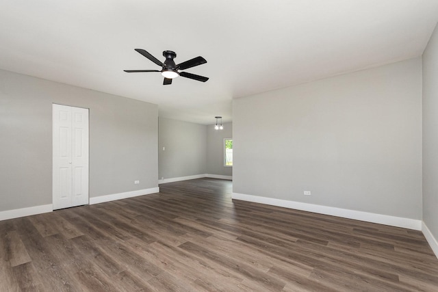 16632 Sawyer Ave, Markham, IL 60428 - spare room with ceiling fan, dark wood finished floors, and a chandelier