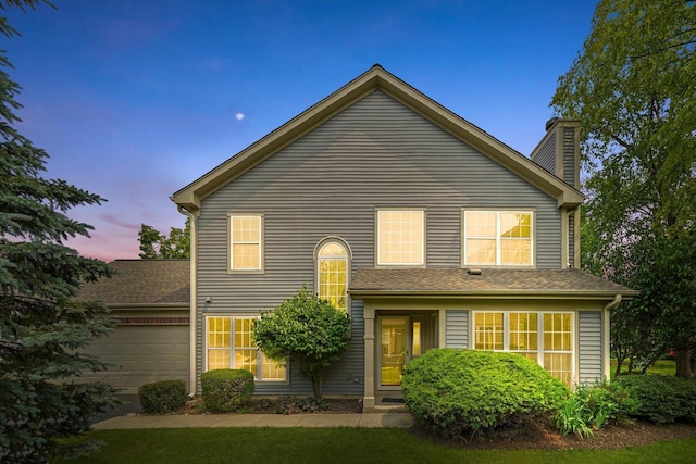 881 Dandridge Ct, Elgin, IL 60120 - traditional-style home featuring a garage and a chimney