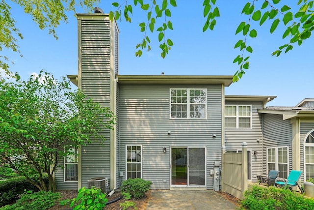 881 Dandridge Ct, Elgin, IL 60120 - back of property with a patio area and a chimney