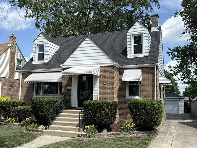 3666 176th Pl, Lansing, IL 60438 - cape cod house with brick siding, a chimney, an outdoor structure, and roof with shingles