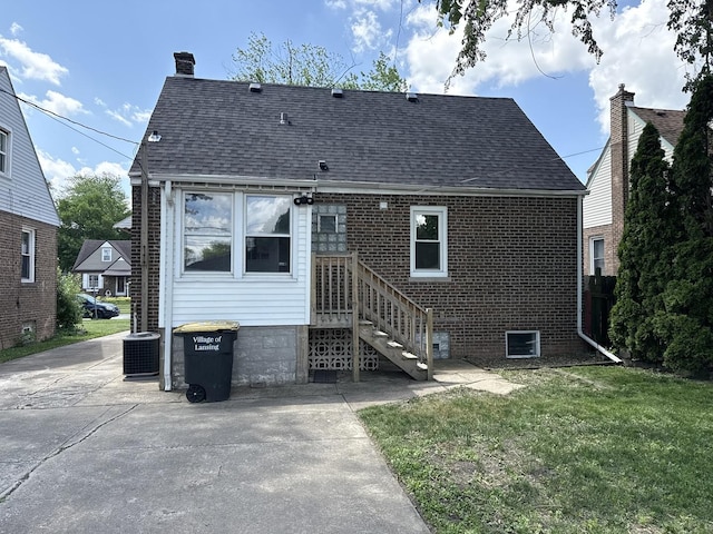3666 176th Pl, Lansing, IL 60438 - back of property with roof with shingles, a lawn, a chimney, and brick siding