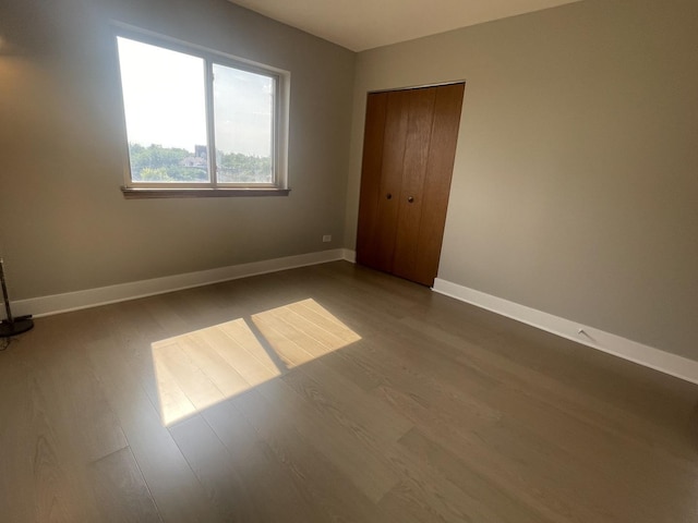 4125 N Keystone Ave Unit 605, Chicago, IL 60641 - unfurnished bedroom with wood finished floors and a closet