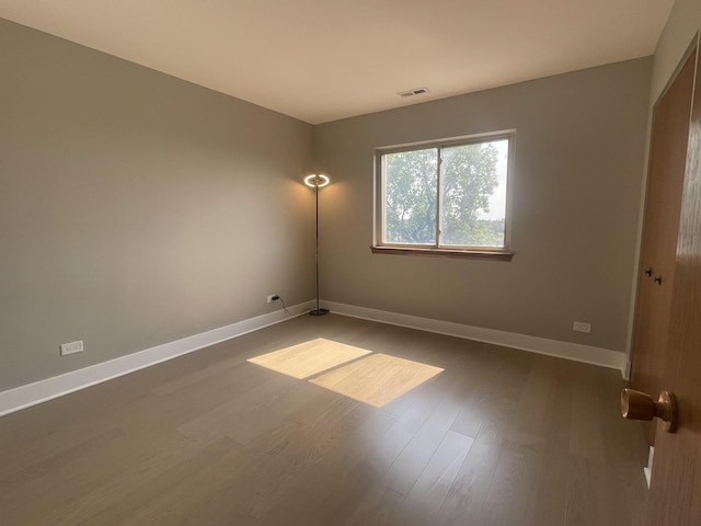 4125 N Keystone Ave Unit 605, Chicago, IL 60641 - unfurnished room with dark wood-type flooring and baseboards