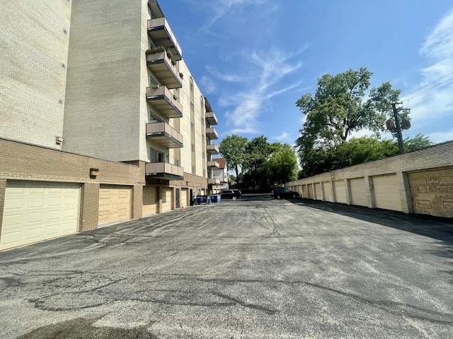 4125 N Keystone Ave Unit 605, Chicago, IL 60641 - view of asphalt road featuring community garages