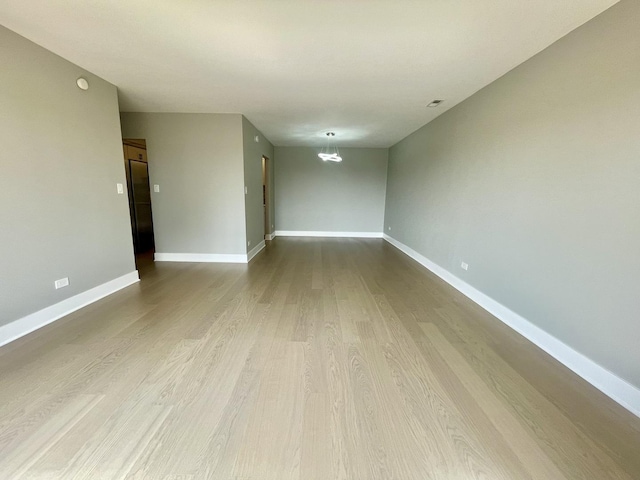 4125 N Keystone Ave Unit 605, Chicago, IL 60641 - empty room featuring dark wood-type flooring and baseboards