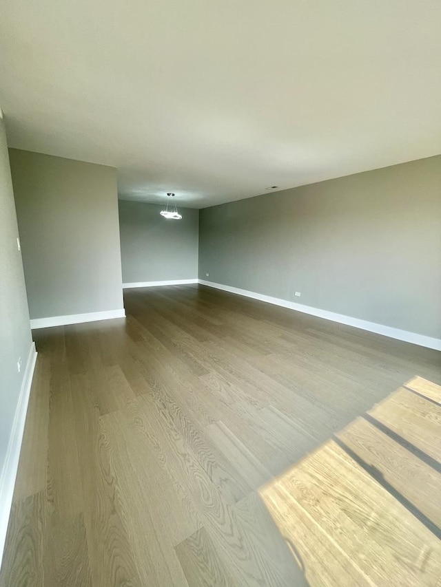 4125 N Keystone Ave Unit 605, Chicago, IL 60641 - unfurnished room with dark wood-type flooring and baseboards