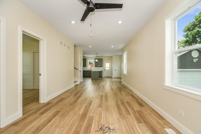 223 E 20th Ct, Lockport, IL 60441 - unfurnished living room with light wood finished floors, ceiling fan, and recessed lighting