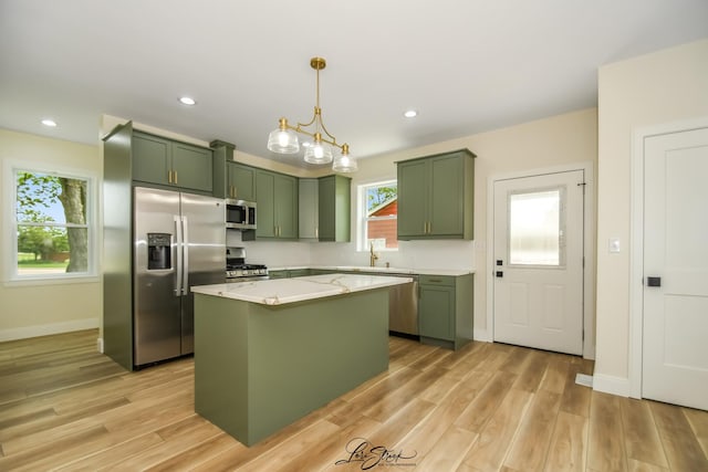 223 E 20th Ct, Lockport, IL 60441 - kitchen with green cabinetry, stainless steel appliances, light wood finished floors, a center island, and recessed lighting
