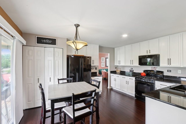 2025 Westbury Ln, Aurora, IL 60502 - kitchen featuring black appliances, plenty of natural light, dark countertops, white cabinets, and recessed lighting