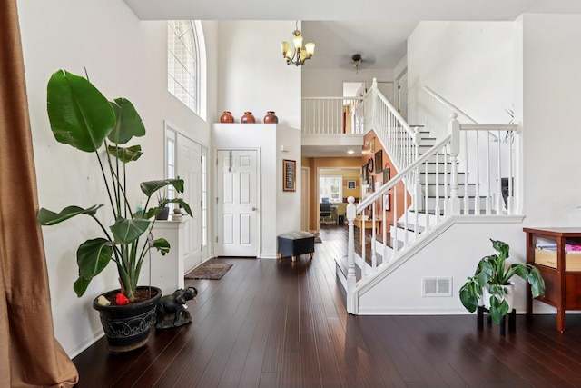 2025 Westbury Ln, Aurora, IL 60502 - entrance foyer with stairs, a chandelier, hardwood / wood-style flooring, and a towering ceiling