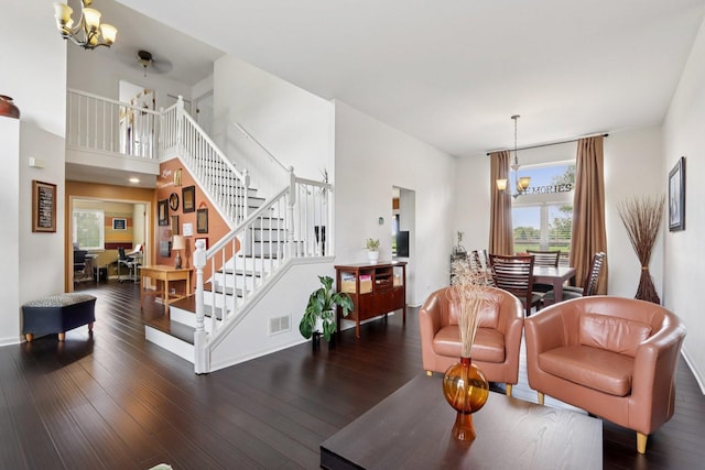 2025 Westbury Ln, Aurora, IL 60502 - living area with a chandelier, stairway, and wood finished floors