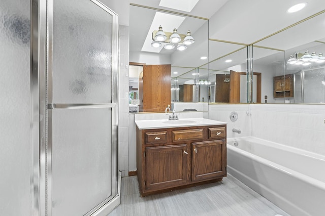 7008 Plymouth Ct Unit 7008, Tinley Park, IL 60477 - bathroom with a stall shower, vanity, a garden tub, a skylight, and recessed lighting
