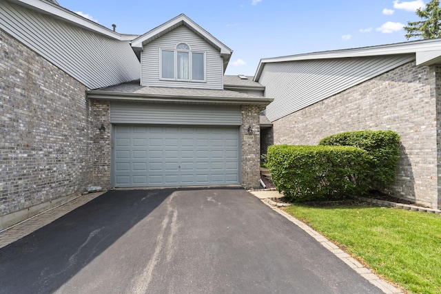 7008 Plymouth Ct Unit 7008, Tinley Park, IL 60477 - garage with asphalt driveway