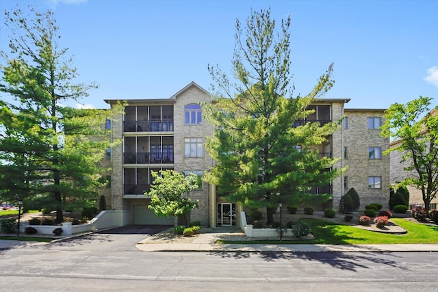 6321 Pine Ridge Ct Unit 2D, Tinley Park, IL 60477 - view of apartment building / complex with an attached garage and asphalt driveway