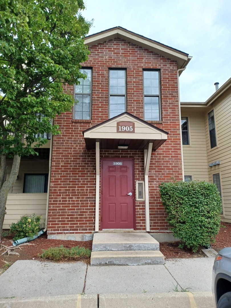1905 N Hicks Rd Unit 206, Palatine, IL 60074 - view of exterior entry featuring brick siding