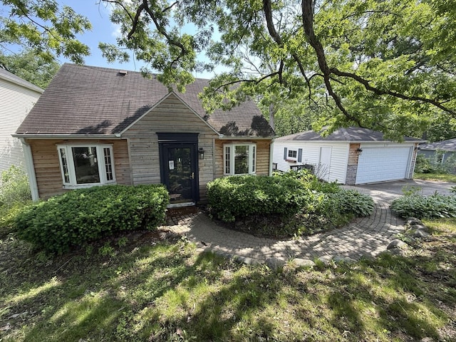 21317 W Shady Ln, Lake Zurich, IL 60047 - view of front of home with an outdoor structure, a detached garage, and a shingled roof