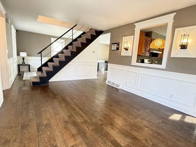 21317 W Shady Ln, Lake Zurich, IL 60047 - unfurnished living room featuring stairs, a decorative wall, wood finished floors, and wainscoting