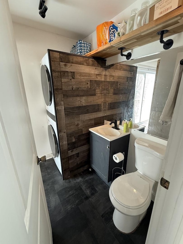 21317 W Shady Ln, Lake Zurich, IL 60047 - bathroom featuring estacked washer and dryer, toilet, and vanity