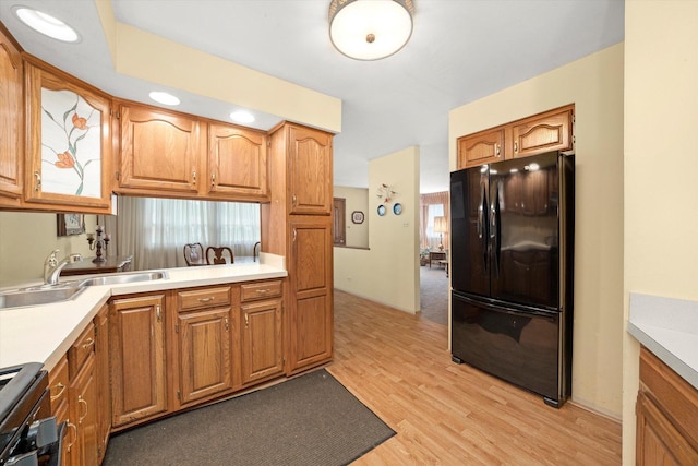 5530 Parkview Ct, Crestwood, IL 60418 - kitchen with freestanding refrigerator, light countertops, light wood-style floors, and stove
