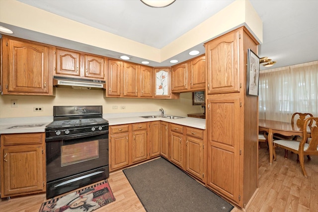 5530 Parkview Ct, Crestwood, IL 60418 - kitchen featuring black stove, under cabinet range hood, light wood-type flooring, light countertops, and recessed lighting