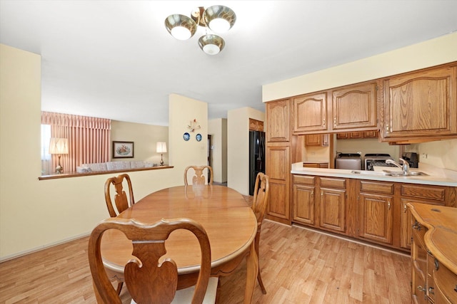 5530 Parkview Ct, Crestwood, IL 60418 - dining space with washer and clothes dryer and light wood-style flooring