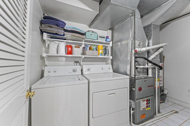 6351 N Glenwood Ave Unit 1S, Chicago, IL 60660 - laundry area with washer and dryer and tile patterned floors